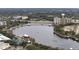 This is an aerial view of a large body of water surrounded by mature trees and buildings at 688 W Cranes Cir, Altamonte Springs, FL 32701