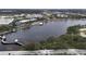 This aerial view shows a body of water with pedestrian walkways, a pavilion and a city skyline at 688 W Cranes Cir, Altamonte Springs, FL 32701