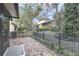Charming brick patio with garden, fence, and trees at 688 W Cranes Cir, Altamonte Springs, FL 32701