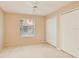 This bedroom has neutral carpet, a window and two closets at 688 W Cranes Cir, Altamonte Springs, FL 32701