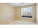 Cozy bedroom features a window seat, neutral carpet, and lots of natural light at 688 W Cranes Cir, Altamonte Springs, FL 32701