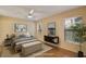 Staged bedroom with neutral walls, a ceiling fan, and hardwood floors at 688 W Cranes Cir, Altamonte Springs, FL 32701