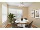Cozy dining area with a stylish table setting, a large window, and elegant decor at 688 W Cranes Cir, Altamonte Springs, FL 32701
