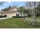 Charming townhome with a well-maintained lawn, featuring mature palms and beautiful landscaping at 688 W Cranes Cir, Altamonte Springs, FL 32701