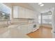 Bright kitchen featuring white appliances, ample counter space, and plenty of natural light at 688 W Cranes Cir, Altamonte Springs, FL 32701