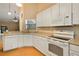 Well-equipped kitchen with modern appliances, white cabinetry, and a convenient breakfast bar at 688 W Cranes Cir, Altamonte Springs, FL 32701