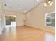 Airy living space featuring hardwood floors, a ceiling fan, and sliding doors to a screened-in lanai at 688 W Cranes Cir, Altamonte Springs, FL 32701