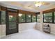Enclosed patio with tile floor, ceiling fan, and windows at 688 W Cranes Cir, Altamonte Springs, FL 32701