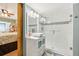 Bright bathroom features a new glass-enclosed shower with a white vanity and modern sink at 702 Glasgow Ct, Winter Springs, FL 32708