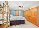 Primary bedroom with ceiling fan, large closets and doorway to another room with barn door at 702 Glasgow Ct, Winter Springs, FL 32708