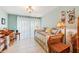 Well-lit bedroom boasts a daybed, a desk, and ample closet space at 702 Glasgow Ct, Winter Springs, FL 32708