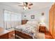 Cozy bedroom with floral bedding, wood floors, and a built-in closet at 702 Glasgow Ct, Winter Springs, FL 32708