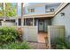 Inviting entrance with tiled patio, decorative wreath, and gated access at 702 Glasgow Ct, Winter Springs, FL 32708