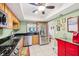 Spacious kitchen featuring stainless appliances, granite counters, and light cabinets at 702 Glasgow Ct, Winter Springs, FL 32708