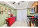 Charming kitchen featuring stainless steel appliances, white tile floors, and a red kitchen island at 702 Glasgow Ct, Winter Springs, FL 32708