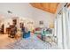 Open living area with tile floors, vaulted wood ceiling, and comfortable furniture at 702 Glasgow Ct, Winter Springs, FL 32708
