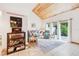 Bright living room with vaulted wood ceilings and stylish furnishings at 702 Glasgow Ct, Winter Springs, FL 32708