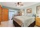 Light bedroom with an open living area and ceiling fan at 702 Glasgow Ct, Winter Springs, FL 32708