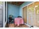 Screened in patio with cozy seating area and sliding glass door access at 702 Glasgow Ct, Winter Springs, FL 32708