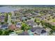 Beautiful aerial view of a residential community, showcasing lush landscaping and diverse home styles at 7605 Lake Hancock Blvd, Winter Garden, FL 34787