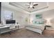 Bright bedroom with tray ceiling, a large window, and a dedicated workstation at 7605 Lake Hancock Blvd, Winter Garden, FL 34787