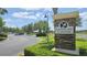Landscaped sign for the Summerlake Clubhouse, offering a warm welcome with an inviting parkway and nearby lake at 7605 Lake Hancock Blvd, Winter Garden, FL 34787