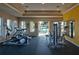 Well-equipped fitness center with modern exercise machines and a view of the refreshing outdoor pool at 7605 Lake Hancock Blvd, Winter Garden, FL 34787