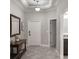 Inviting foyer with tile flooring and neutral decor provides a grand entrance at 7605 Lake Hancock Blvd, Winter Garden, FL 34787