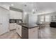 Kitchen featuring stainless steel appliances, central island with sink, and eat-in dining space at 7605 Lake Hancock Blvd, Winter Garden, FL 34787