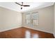 Bright bedroom with wood floors, ceiling fan and windows with lots of natural light at 8031 Enchantment Dr # Ge, Windermere, FL 34786