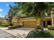 Charming townhouse with two-car garage, lush front yard landscaping and inviting curb appeal at 8031 Enchantment Dr # Ge, Windermere, FL 34786