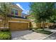 Inviting townhouse with a spacious two-car garage, beautifully landscaped front yard, and a charming facade at 8031 Enchantment Dr # Ge, Windermere, FL 34786