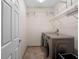 Laundry room equipped with washer, dryer, and wire shelving at 8031 Enchantment Dr # Ge, Windermere, FL 34786