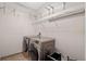 Laundry room equipped with washer, dryer, and wire shelving at 8031 Enchantment Dr # Ge, Windermere, FL 34786