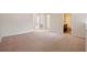 A large living area featuring a neutral color scheme and plush carpeting at 8031 Enchantment Dr # Ge, Windermere, FL 34786