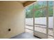 Enclosed outdoor patio with a screen door and view of the fenced backyard at 8031 Enchantment Dr # Ge, Windermere, FL 34786