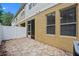 Tan home exterior with enclosed patio, with a screen door and white privacy fence at 8031 Enchantment Dr # Ge, Windermere, FL 34786