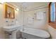 Charming bathroom features vintage-style fixtures, tile, and clawfoot tub at 806 E Amelia St, Orlando, FL 32803