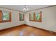 Spacious bedroom with hardwood floors and natural light from the windows at 806 E Amelia St, Orlando, FL 32803