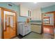 Retro kitchen with custom cabinets, colorful walls and vintage stove at 806 E Amelia St, Orlando, FL 32803