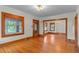 Bright living room with hardwood floors, wood trim, and lots of windows at 806 E Amelia St, Orlando, FL 32803