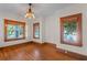 Bright living room with gleaming hardwood floors and large windows at 806 E Amelia St, Orlando, FL 32803