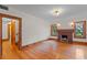 Open living room with a fireplace and hardwood floors provides a welcoming space at 806 E Amelia St, Orlando, FL 32803