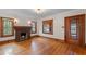 Inviting living room with a charming brick fireplace and gleaming hardwood floors at 806 E Amelia St, Orlando, FL 32803