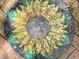 Close-up of a vibrant sunflower mosaic art piece, intricately crafted with colorful tiles at 806 E Amelia St, Orlando, FL 32803