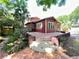 Stunning brick patio featuring mature landscaping and steps leading up to the home at 806 E Amelia St, Orlando, FL 32803