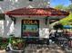 Outdoor seating at EOLA restaurant with a colorful mural and modern decor at 806 E Amelia St, Orlando, FL 32803