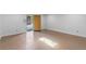 Spacious room featuring a doorway leading outside and ample natural light, ready for customization at 806 E Amelia St, Orlando, FL 32803