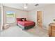 Cozy bedroom with a comfortable bed, soft carpeting, and a connected bathroom, offering a private retreat at 812 Seneca Meadows Rd, Winter Springs, FL 32708