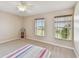 Inviting bedroom with large windows, plush carpeting, and neutral walls, creating a serene and peaceful atmosphere at 812 Seneca Meadows Rd, Winter Springs, FL 32708